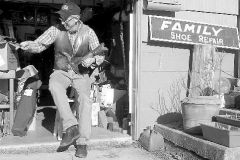 John at the current shop storefront, in his garage on Highland Drive.